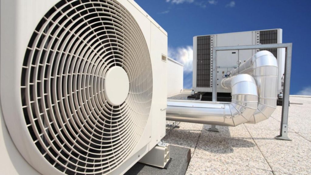 Close-up of white rooftop fan attached to HVAC system