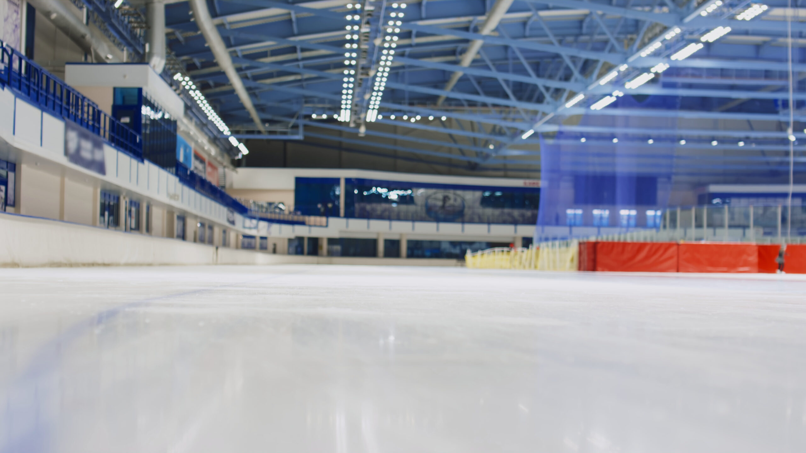 low-angle-shallow-focus-slowmo-shot-of-professional-athlete-speed-skaters-in-full-body-SBI-349593163-scaled